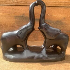 Elephant with trunk to trunk figurines